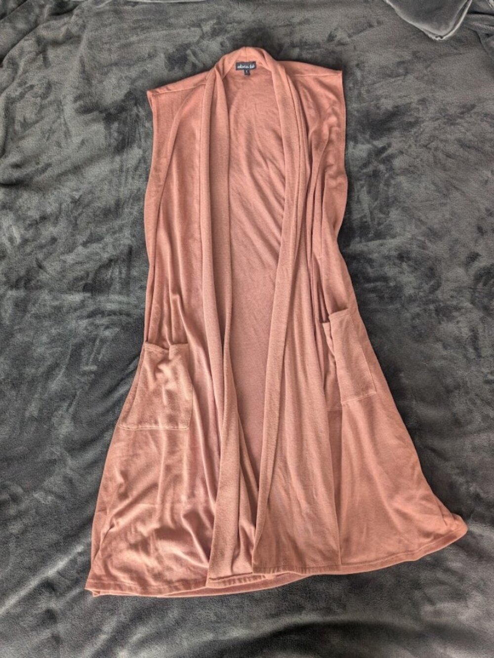 Long sleeveless duster in blush pink. with Pockets.